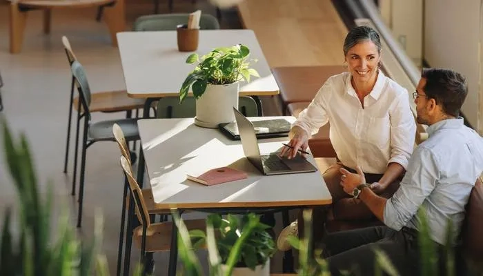Two people sat in a meeting